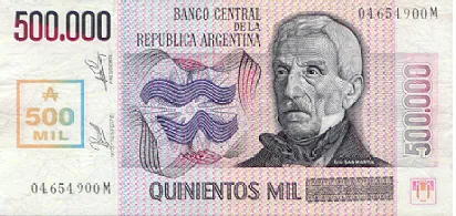 Billete rosado y violeta con la cifra 500.000, el retrato de un hombre mayor de saco oscuro y la leyenda «Quinientos mil».