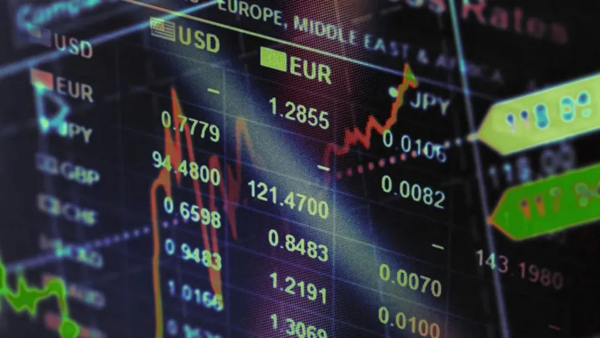 Pantalla con cotizaciones de monedas y gráficos financieros.